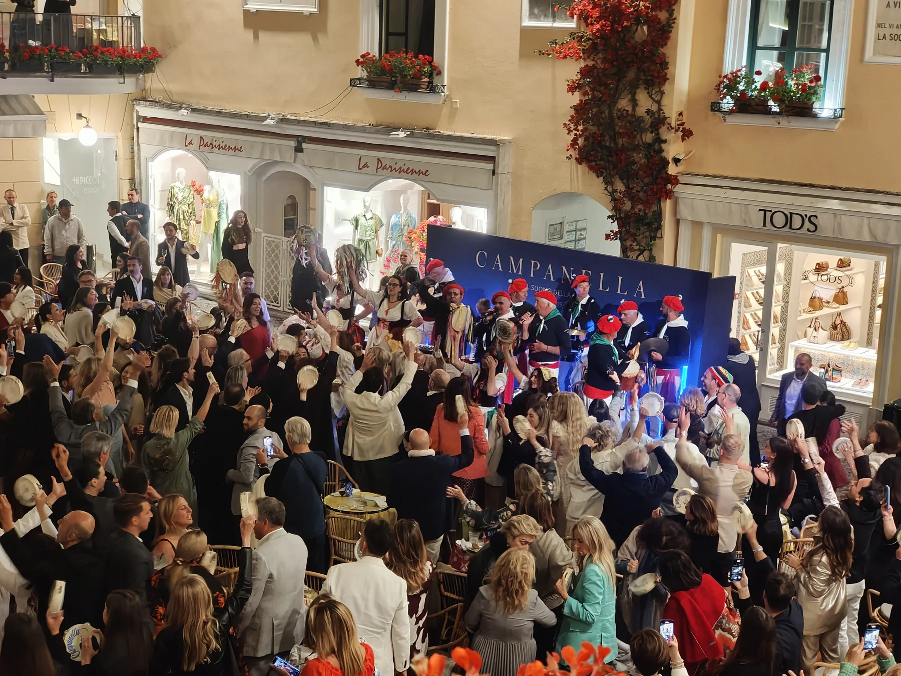 Brand evening in Capri's main square with traditional Campanella performers and crowd celebrating
